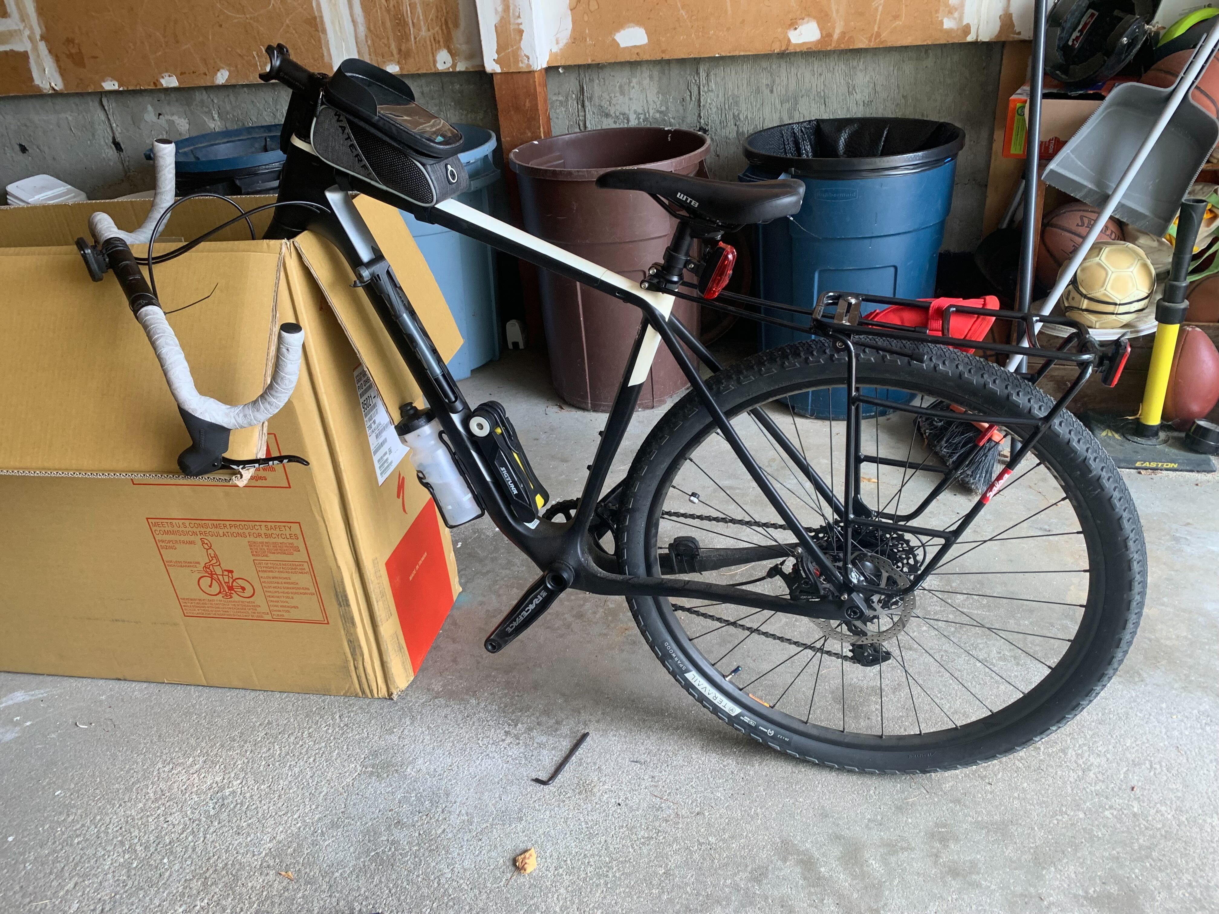 Bike being put into.a box